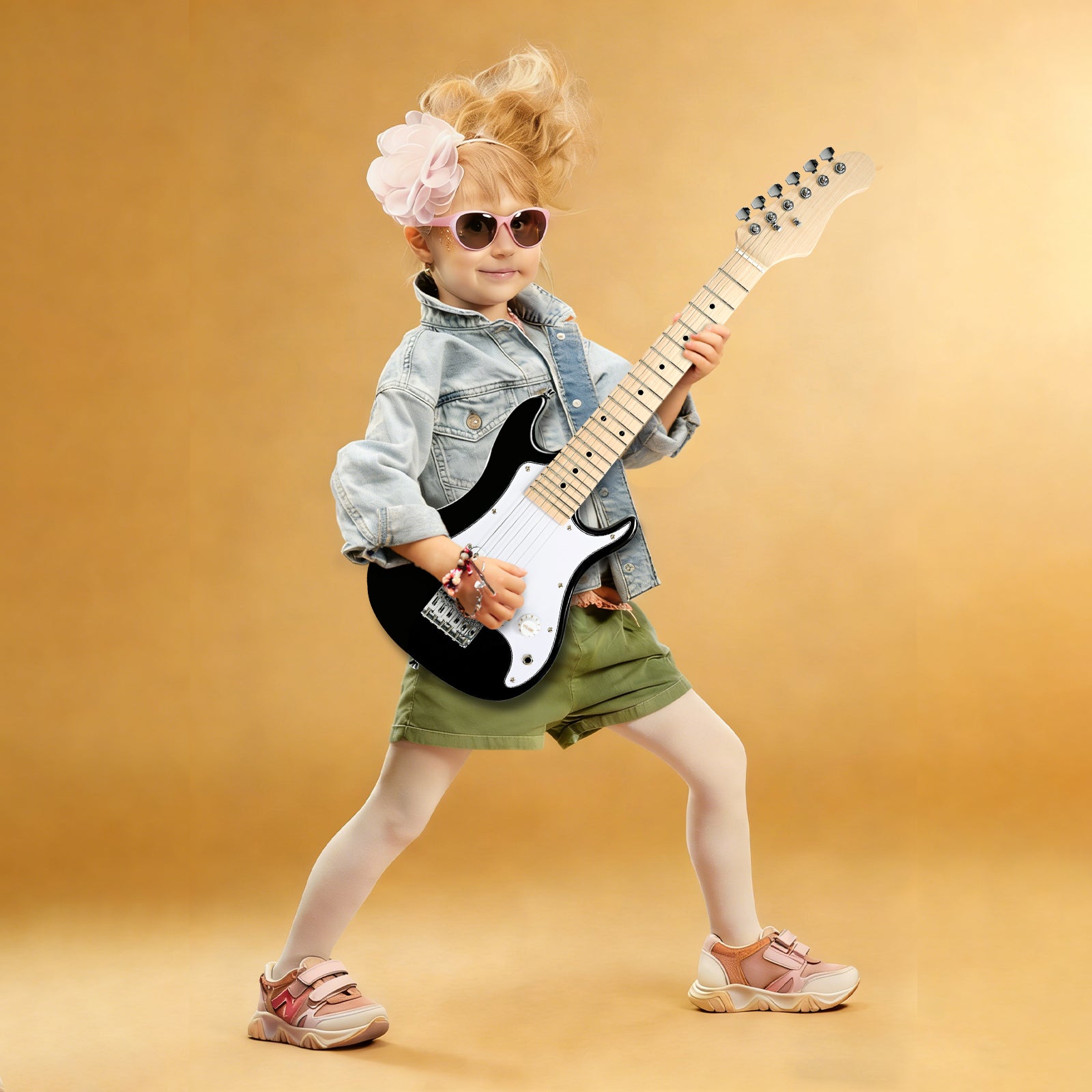 Young girl playing GOLDRIFF 30-inch black kids electric guitar, perfect mini beginner guitar for children ages 3 to 9