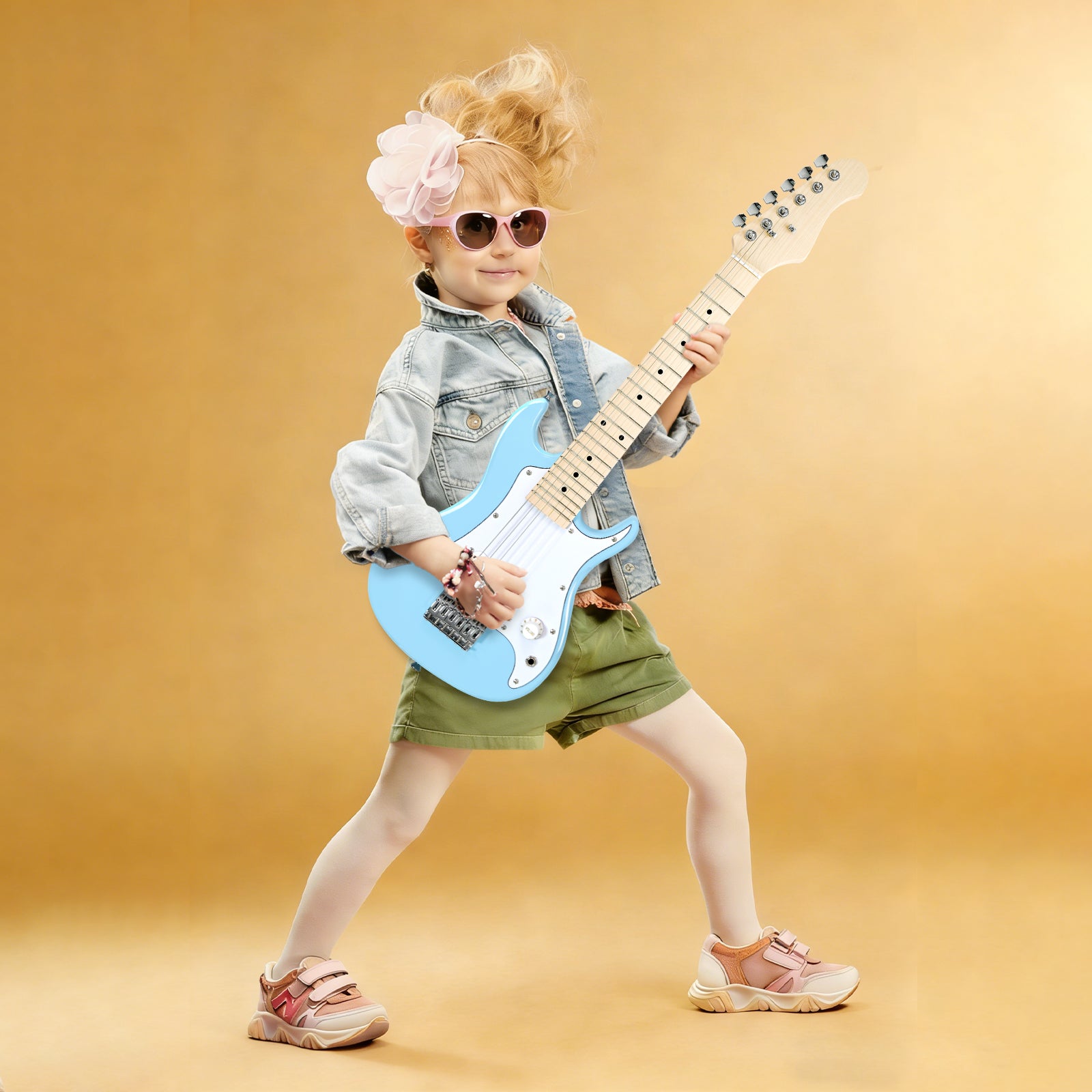 Young girl playing GOLDRIFF 30-inch blue kids electric guitar, perfect mini beginner guitar for children ages 3 to 9
