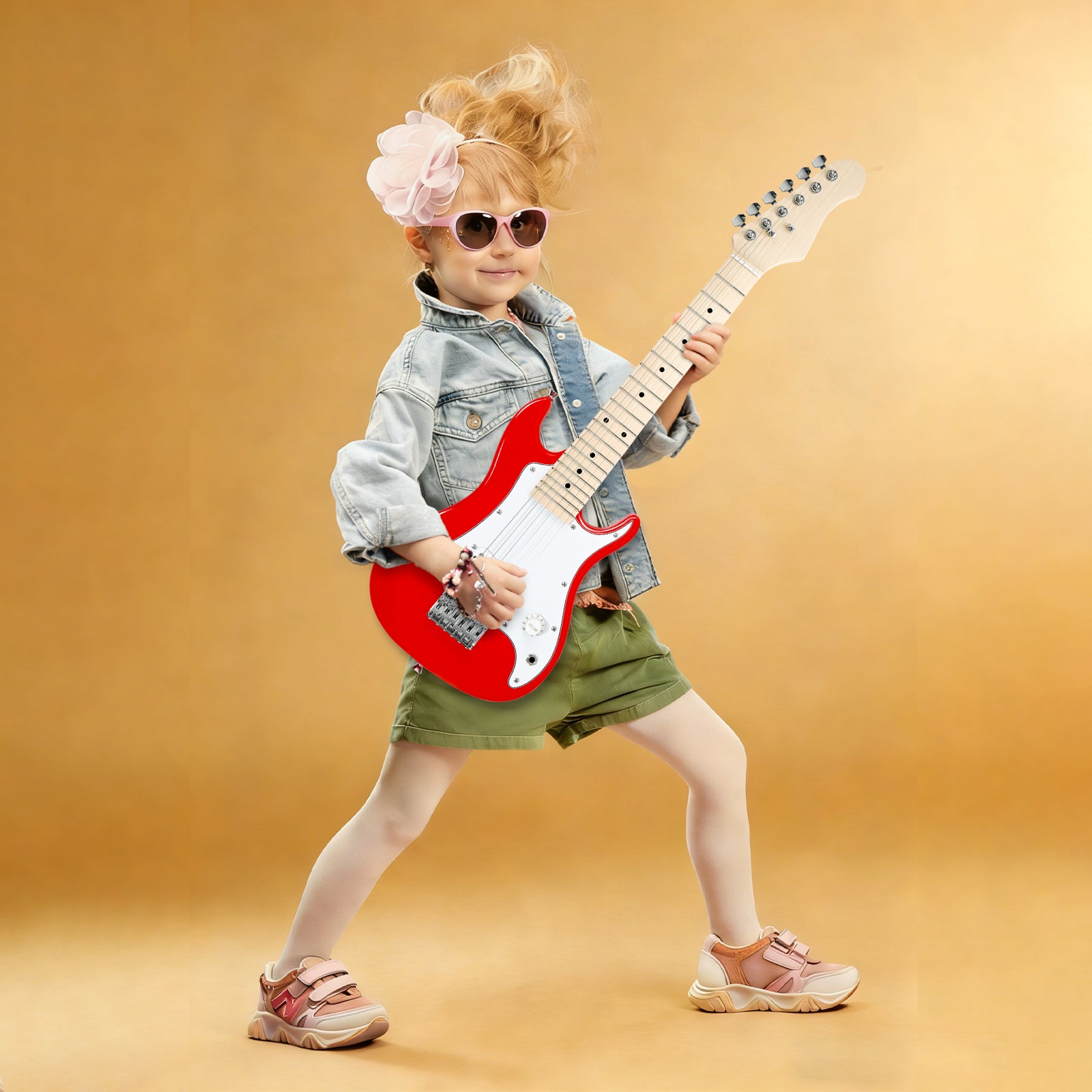 Young girl playing GOLDRIFF 30-inch red kids electric guitar, perfect mini beginner guitar for children ages 3 to 9