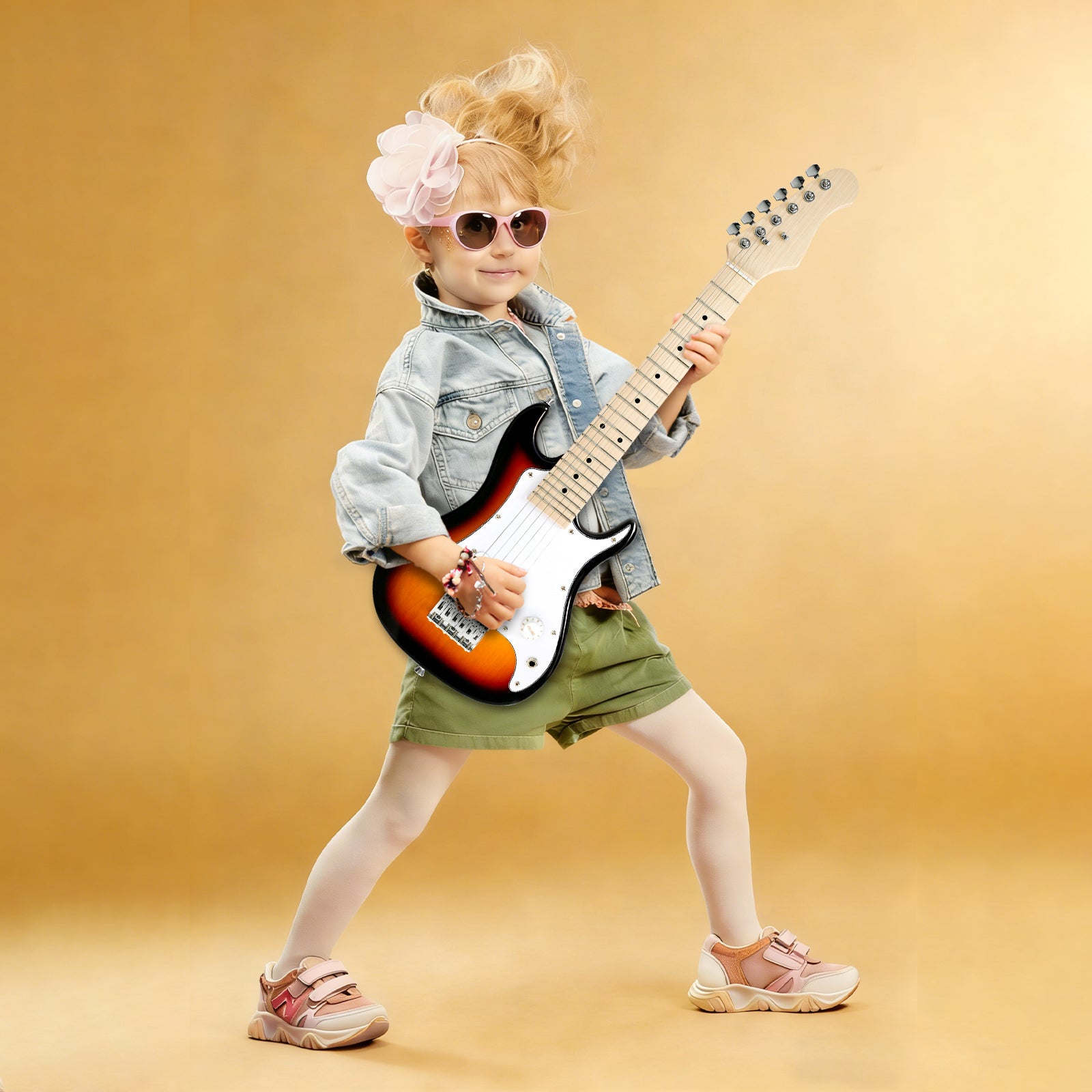 Young girl playing GOLDRIFF 30-inch sunburst kids electric guitar, perfect mini beginner guitar for children ages 3 to 9
